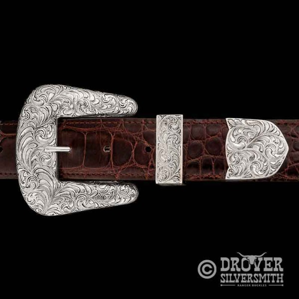 The Rancher Sterling Silver Belt Buckle is a tribute to rugged elegance featuring the absolute Classic Traditional Western Style. Hand engraved silver buckle, loop and tip.  Add a second loop for a ranger buckle set now!